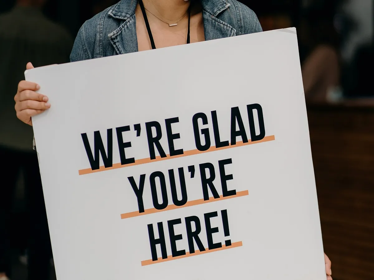 were-glad-youre-here-sign.webp